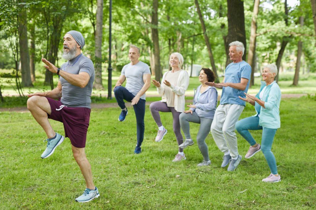 Sporty Aged People In Park